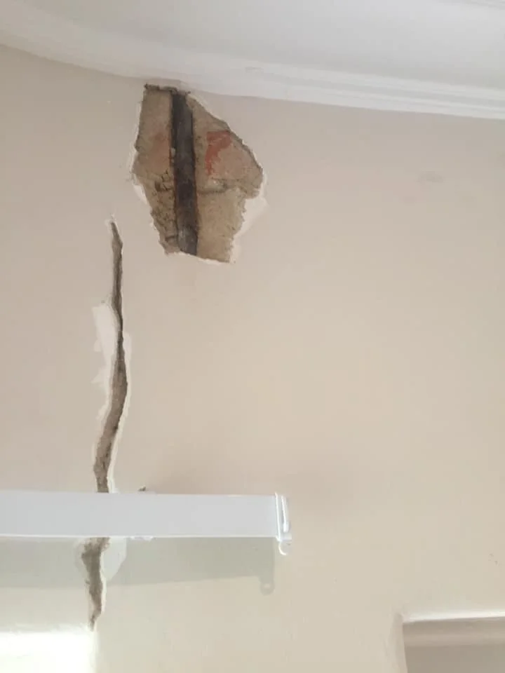 Cracked plaster repaired before painting, before